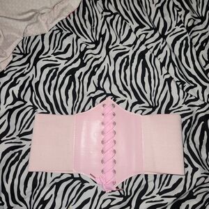 Pink corset belt with silver eyelets